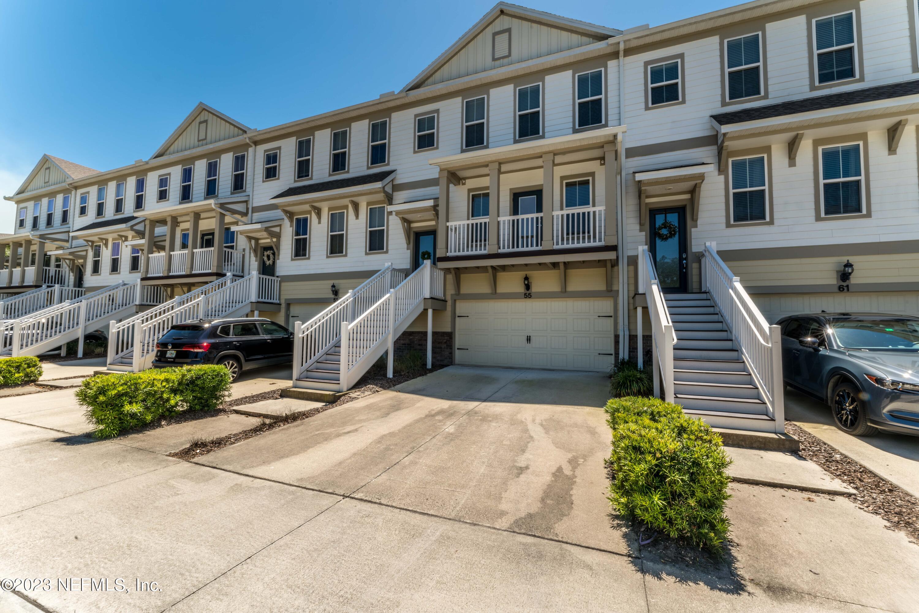 55 Spring Tide Way Ponte Vedra, FL 32081 - Photo 4 of 75 a front view of a building with garden