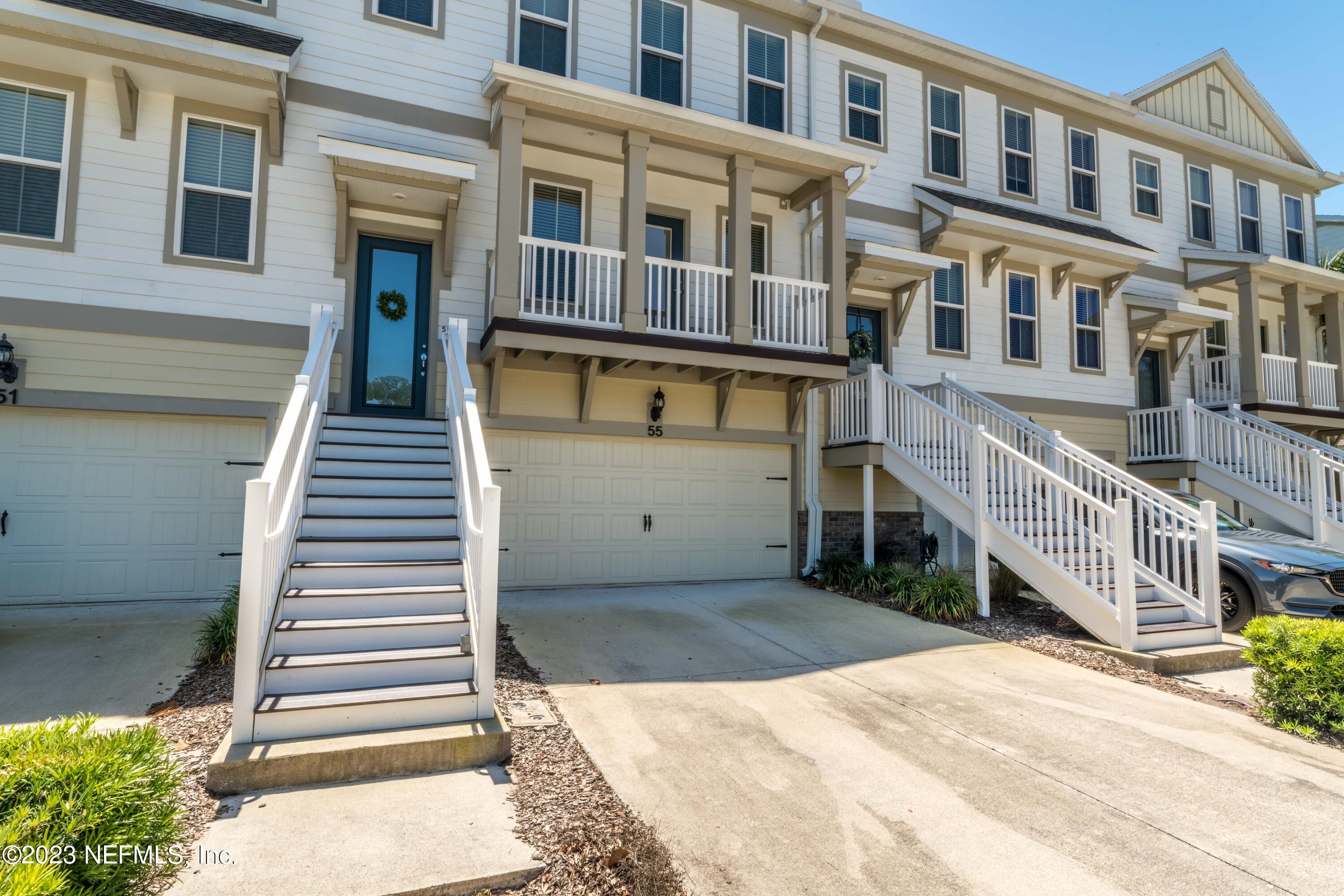 55 Spring Tide Way Ponte Vedra, FL 32081 - Photo 5 of 75 a front view of a building with a outdoor space