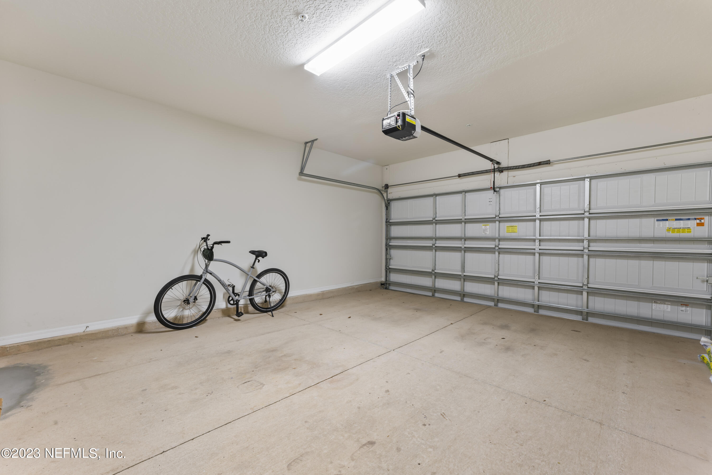 55 Spring Tide Way Ponte Vedra, FL 32081 - Photo 53 of 75 a view of a garage with rack on the wall