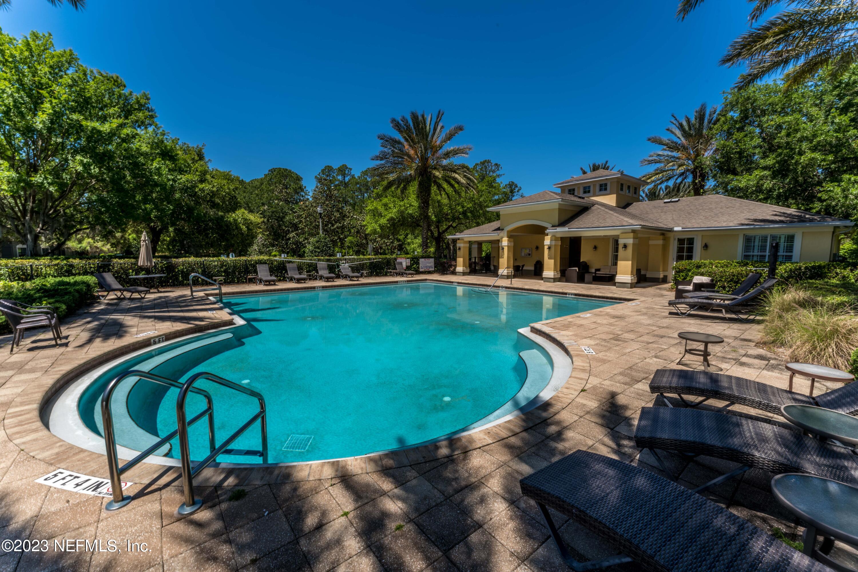 55 Spring Tide Way Ponte Vedra, FL 32081 - Photo 56 of 75 a view of a swimming pool with a patio and swimming pool