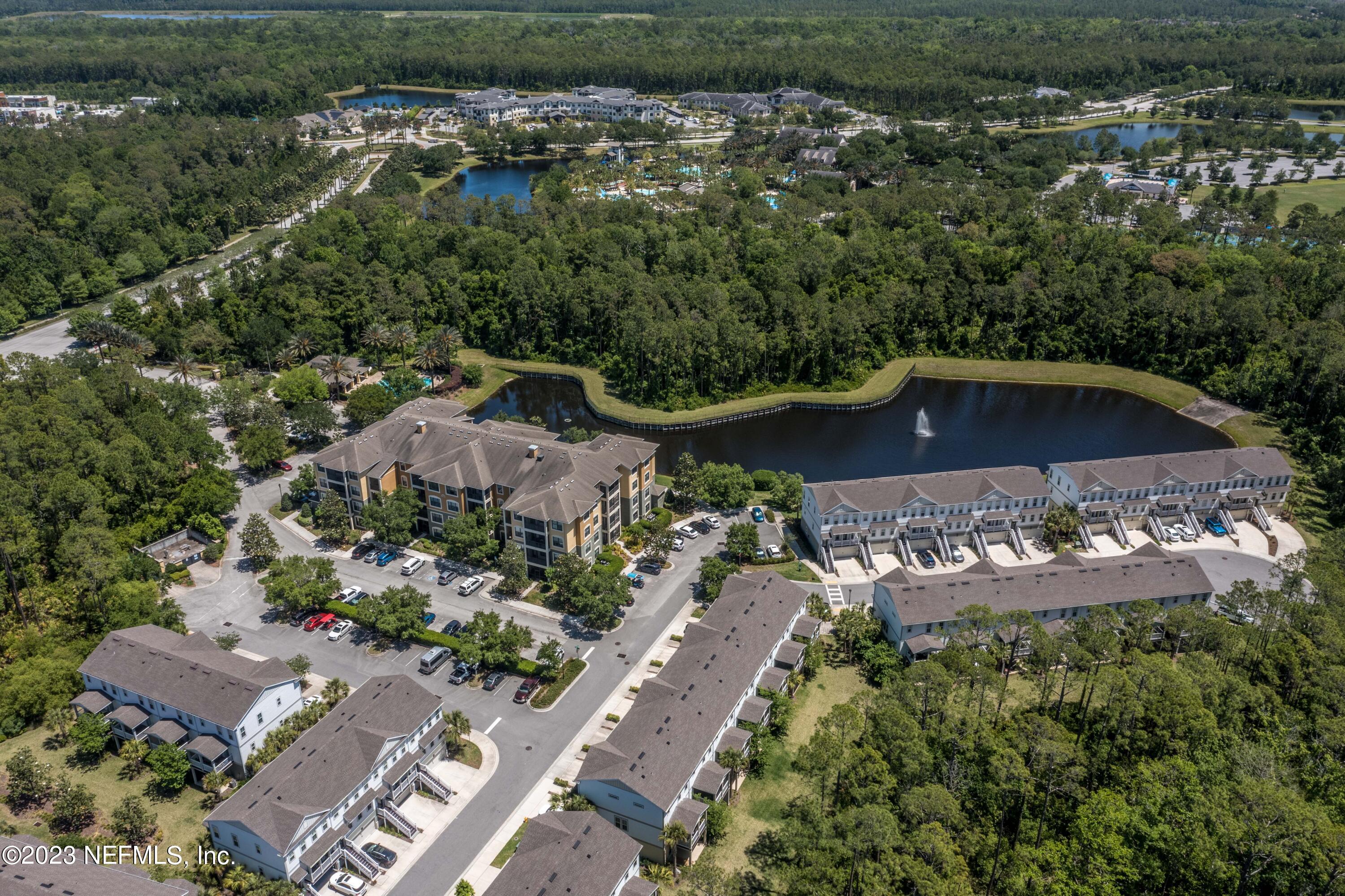 55 Spring Tide Way Ponte Vedra, FL 32081 - Photo 61 of 75 an aerial view of a house with a yard and lake view