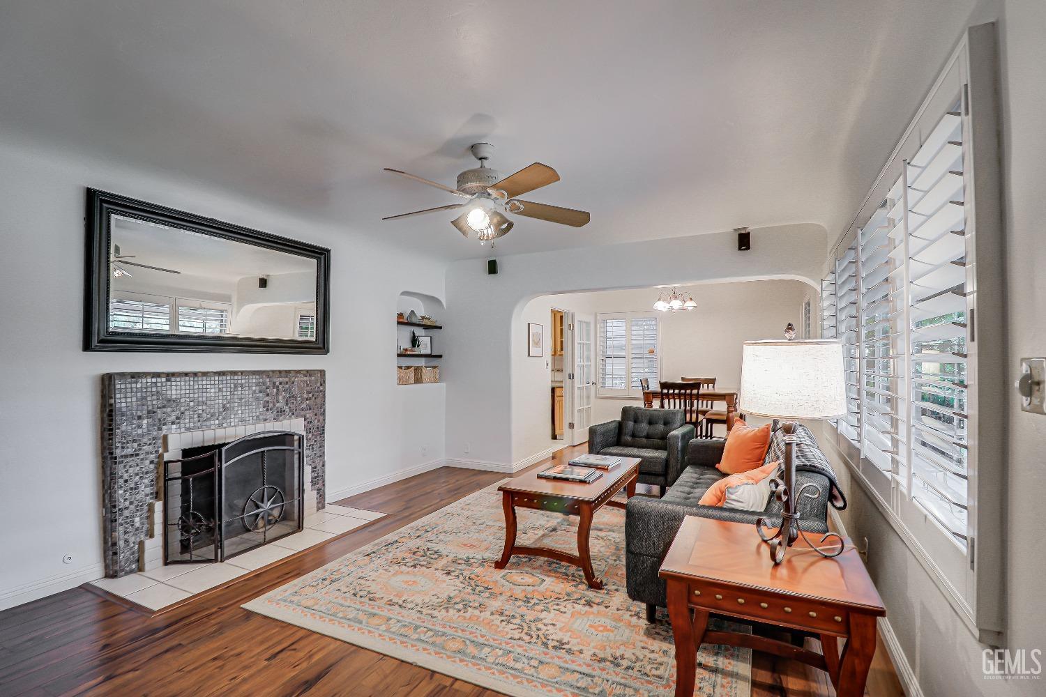Undisclosed Address Bakersfield, CA 93305 - Photo 6 of 24 a living room with furniture and a fireplace