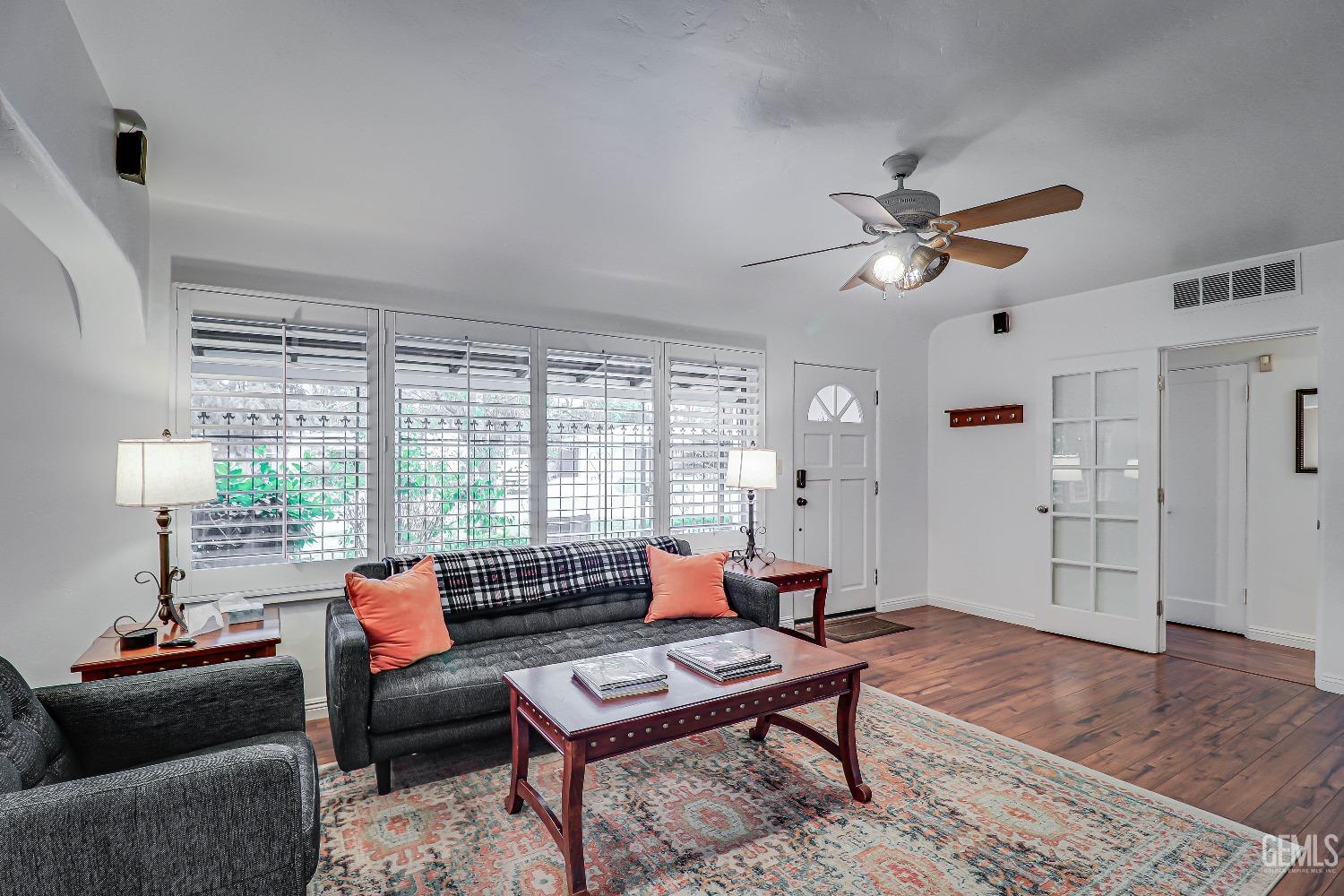 Undisclosed Address Bakersfield, CA 93305 - Photo 8 of 24 a living room with furniture a chandelier and a window