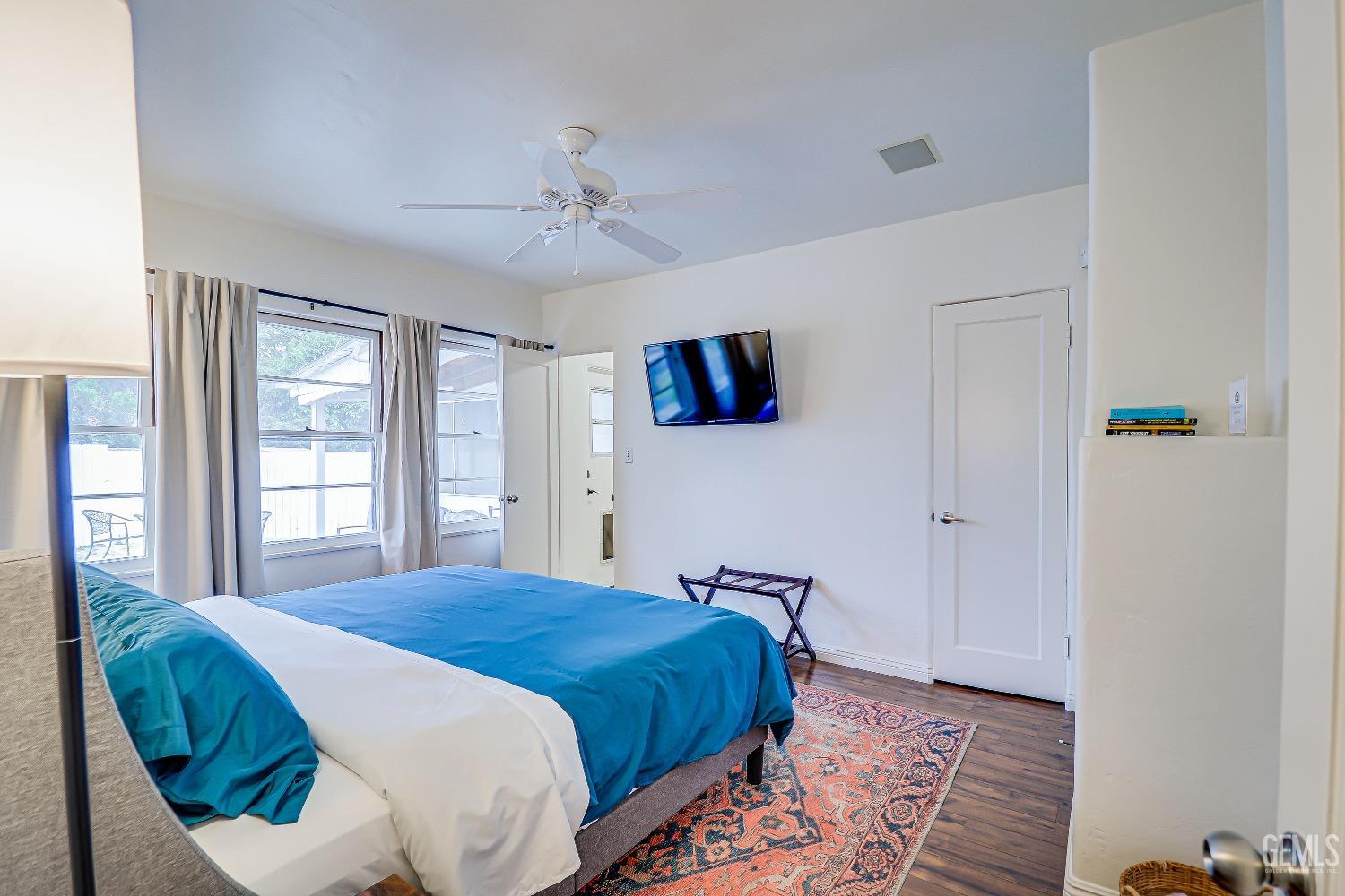 Undisclosed Address Bakersfield, CA 93305 - Photo 10 of 24 a bedroom with a large bed and a window