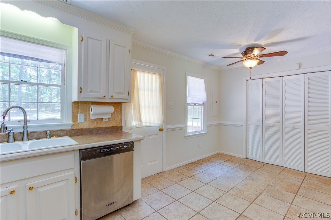 7460 Strath Road Henrico, VA 23231 - Photo 13 of 32 a kitchen with a stove a sink and a window
