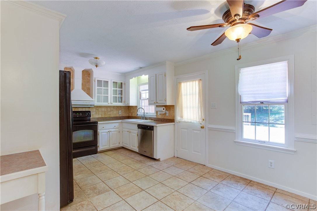 7460 Strath Road Henrico, VA 23231 - Photo 14 of 32 a kitchen with a cabinets and chandelier