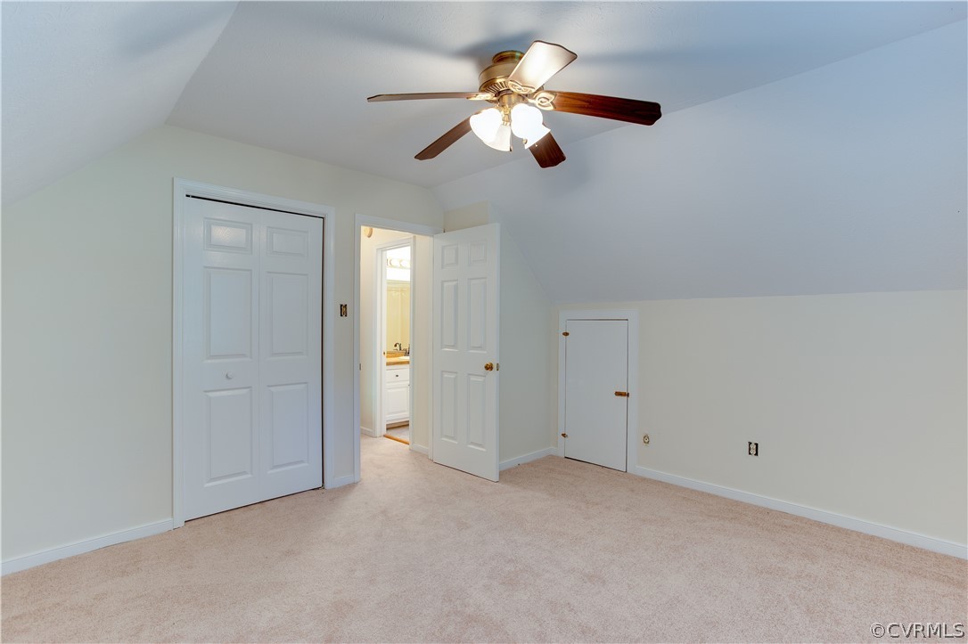 7460 Strath Road Henrico, VA 23231 - Photo 21 of 32 an empty room with a chandelier fan and closet area