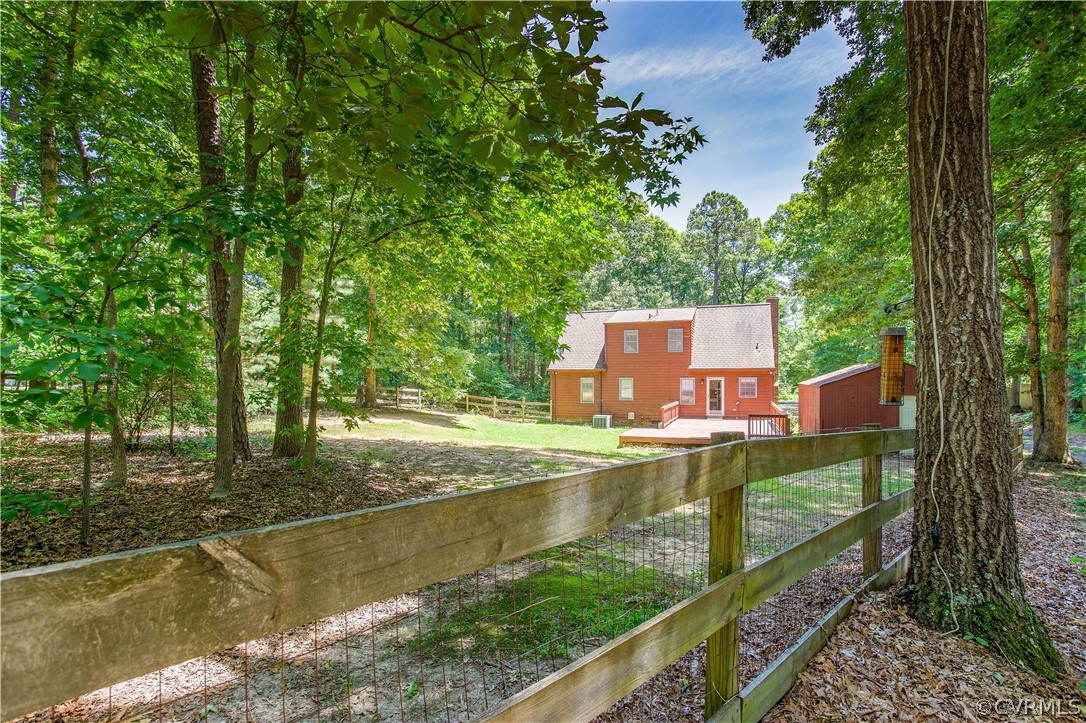 7460 Strath Road Henrico, VA 23231 - Photo 27 of 32 a view of a small house with large trees and plants