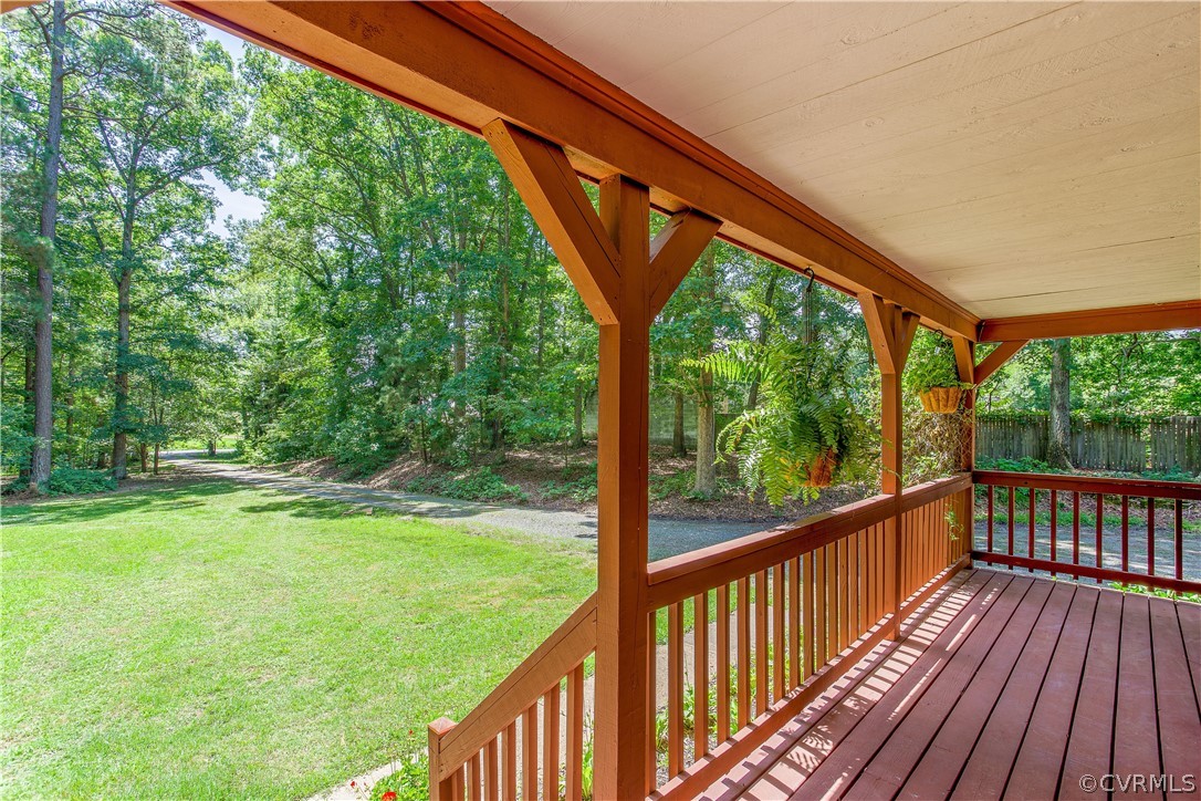 7460 Strath Road Henrico, VA 23231 - Photo 4 of 32 a view of backyard with large trees and wooden fence
