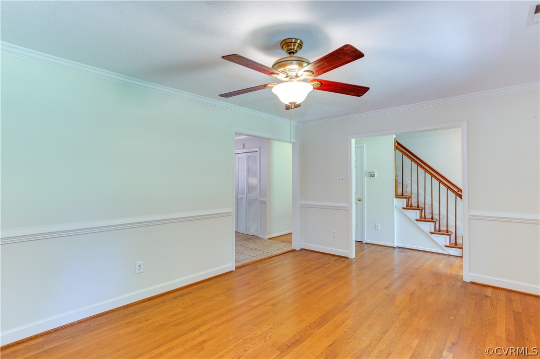 7460 Strath Road Henrico, VA 23231 - Photo 7 of 32 a view of an empty room with wooden floor and a ceiling fan