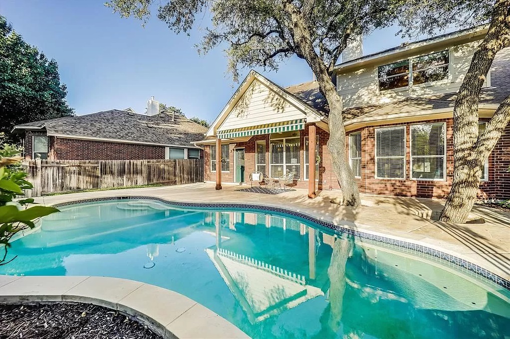 1723 Nelson Ranch Loop Cedar Park, TX 78613 - Photo 2 of 2 Rear view of house featuring a patio and brick siding