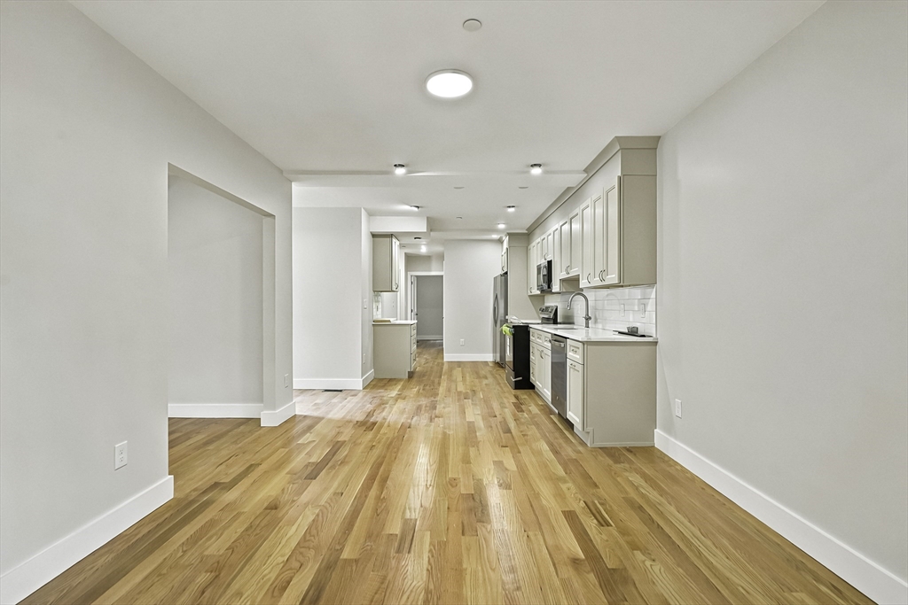 4 Mayhew Street Framingham, MA 01702 - Photo 7 of 42 a view of kitchen with wooden floor