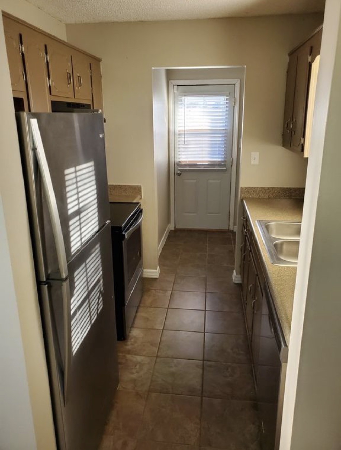 133 Bumpus Mill Road Oak Grove, KY 42262 - Photo 3 of 8 a kitchen with a refrigerator stove and sink