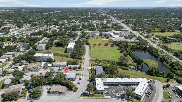 a view of a hallway with wooden floor and stairs