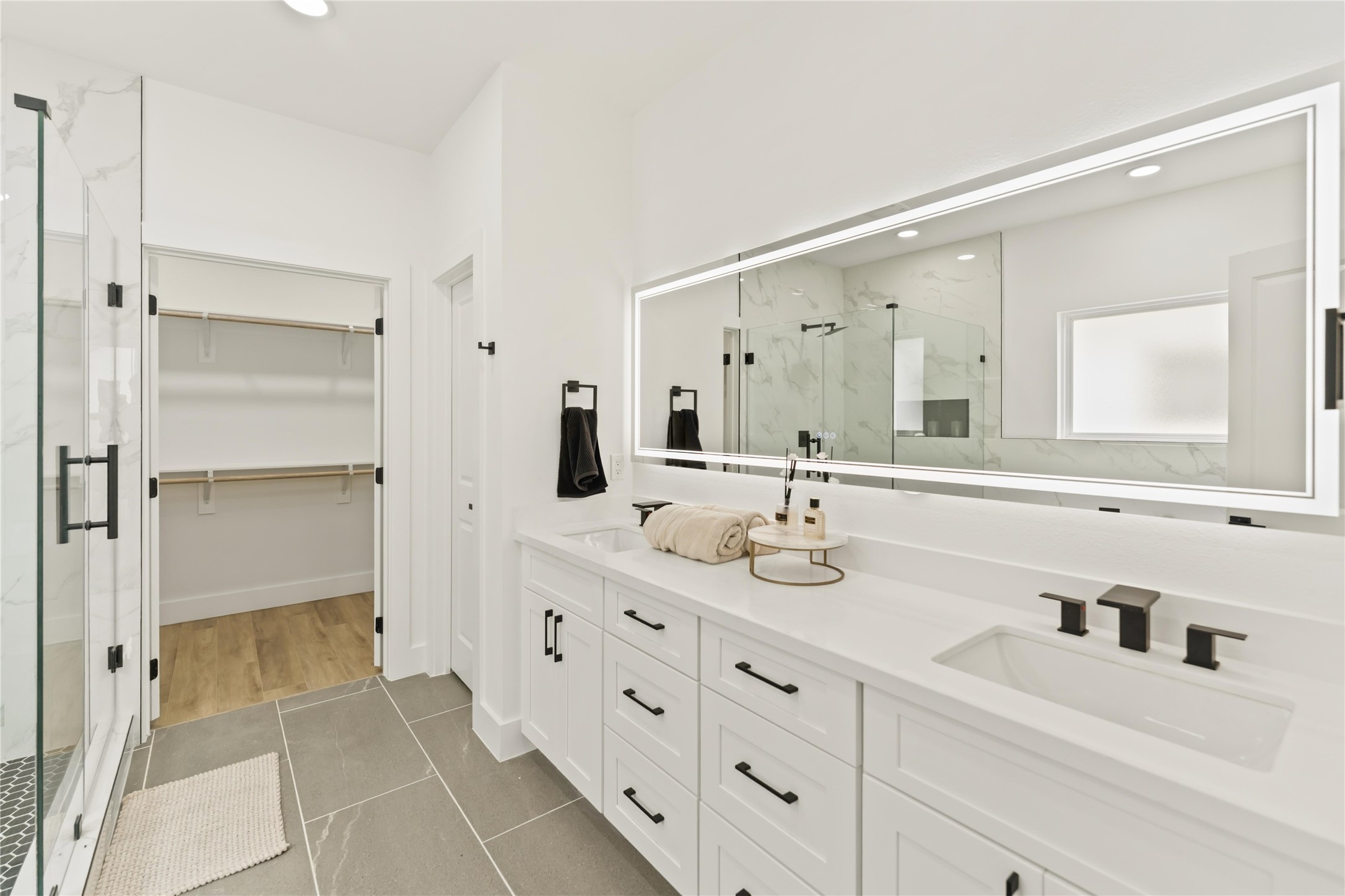 6539 Sealey Street Houston, TX 77091 - Photo 18 of 28 a bathroom with a double vanity sink mirror and