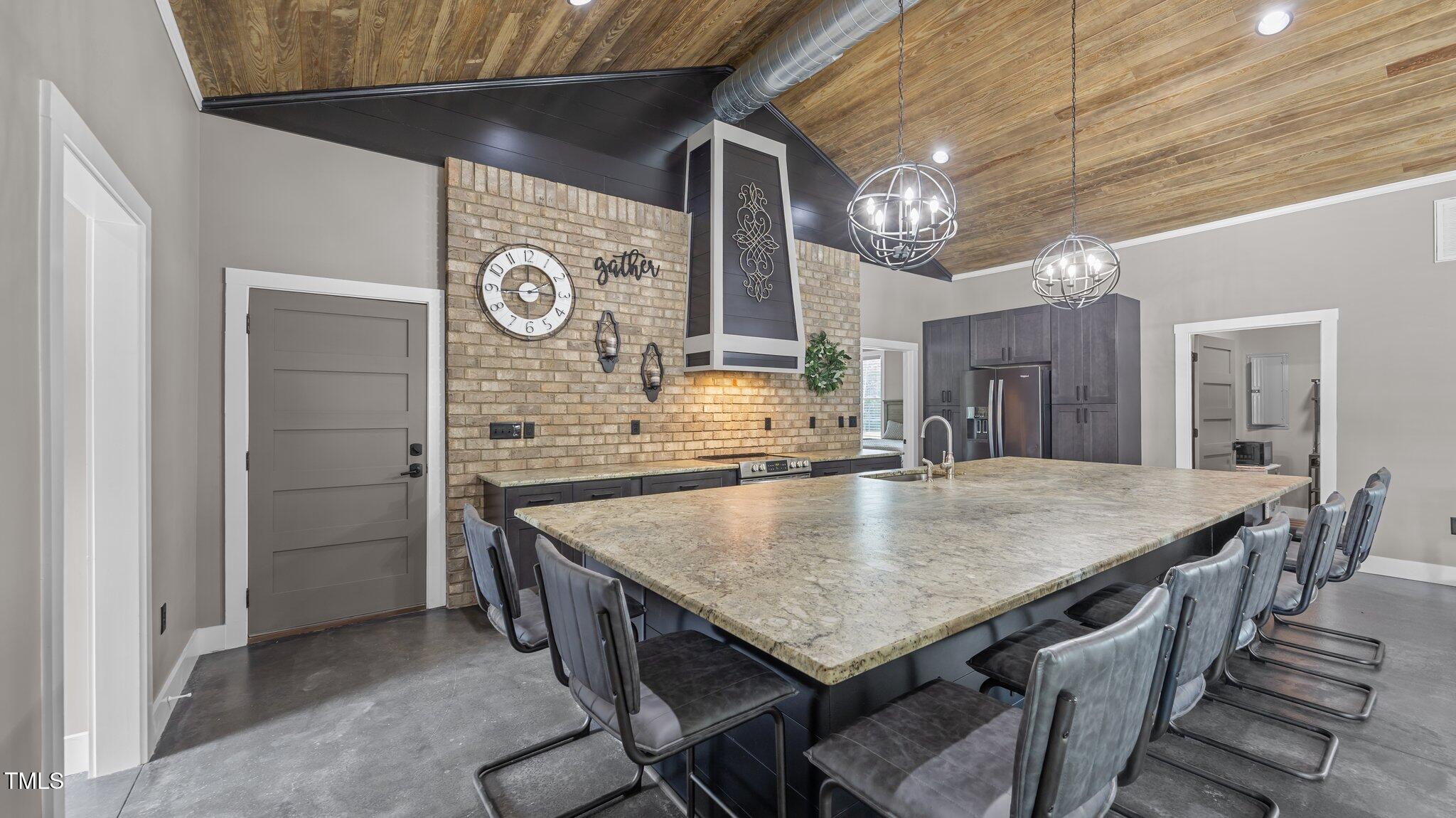 4152 Boyd Wright Road Burlington, NC 27215 - Photo 45 of 65 Brick accent wall with custom hood. Full kitchen. Leathered granite tops. Double pantry cabinets,