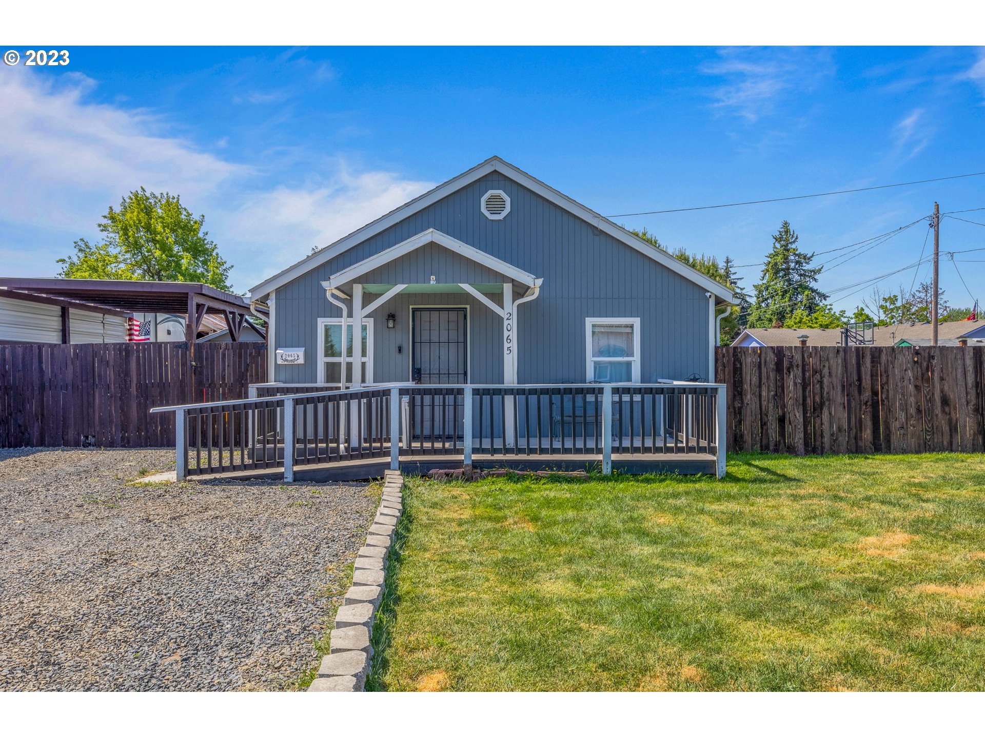 2065 G Street Springfield, OR 97477 - Photo 1 of 37 a view of a house with a yard and a fence