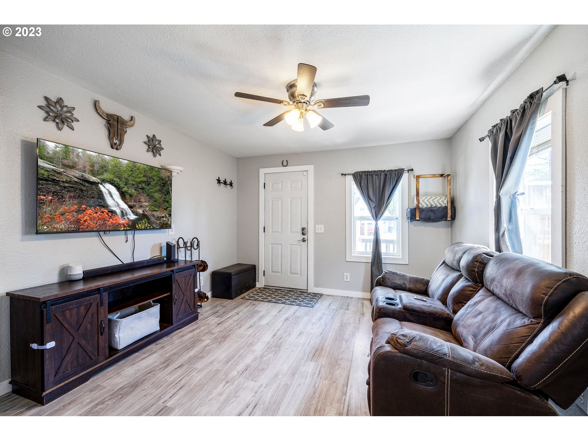 2065 G Street Springfield, OR 97477 - Photo 11 of 37 a living room with furniture and a flat screen tv
