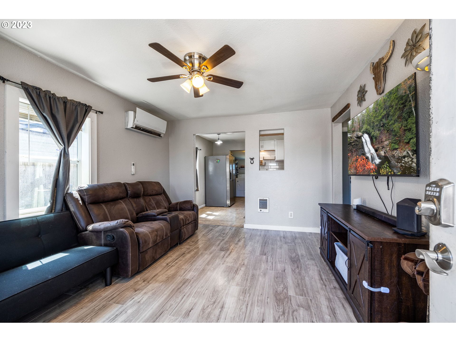 2065 G Street Springfield, OR 97477 - Photo 12 of 37 a living room with furniture and a flat screen tv