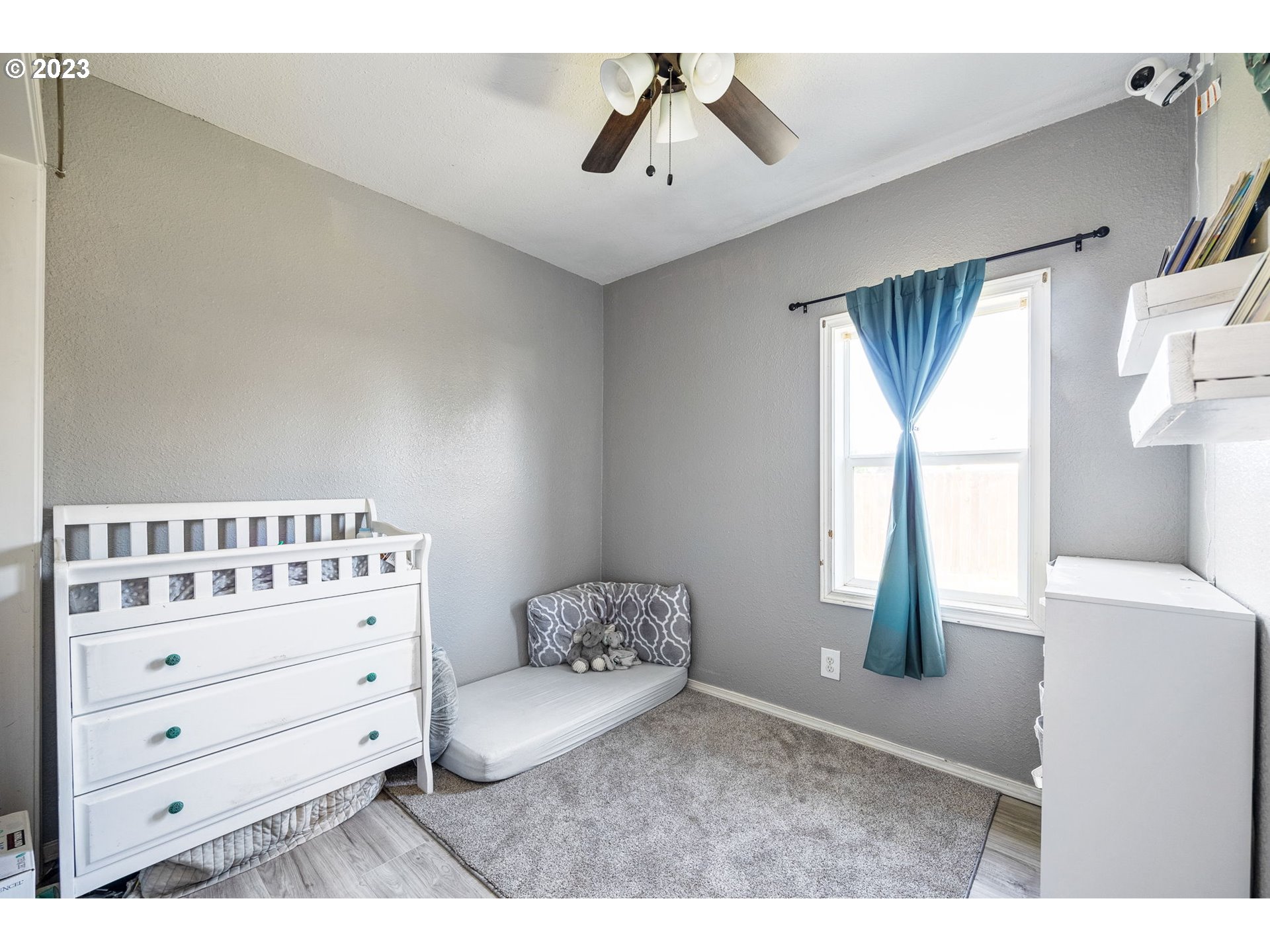 2065 G Street Springfield, OR 97477 - Photo 13 of 37 a bedroom with a bed and a window