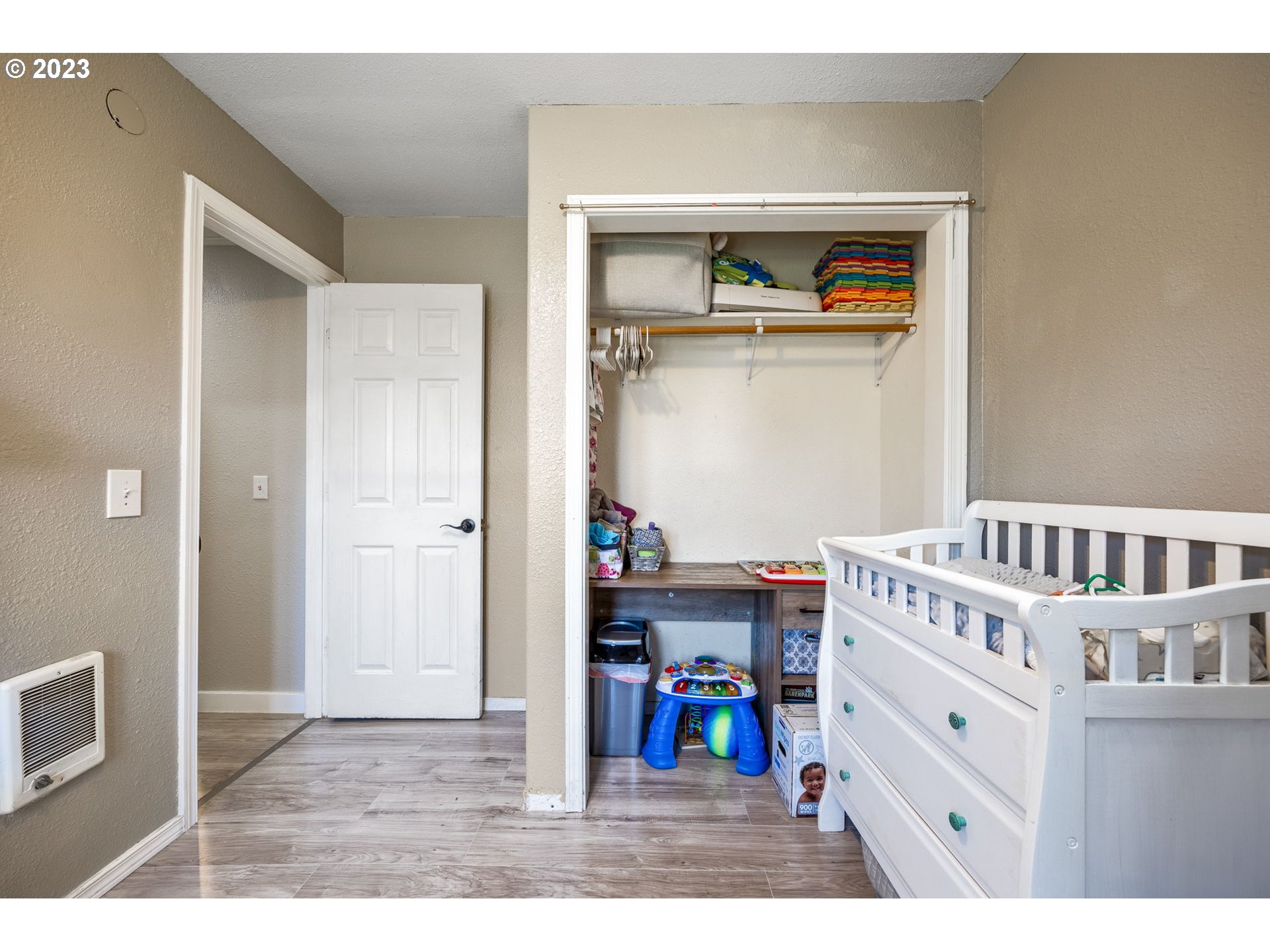 2065 G Street Springfield, OR 97477 - Photo 14 of 37 a view of a bedroom with baby crib and furniture