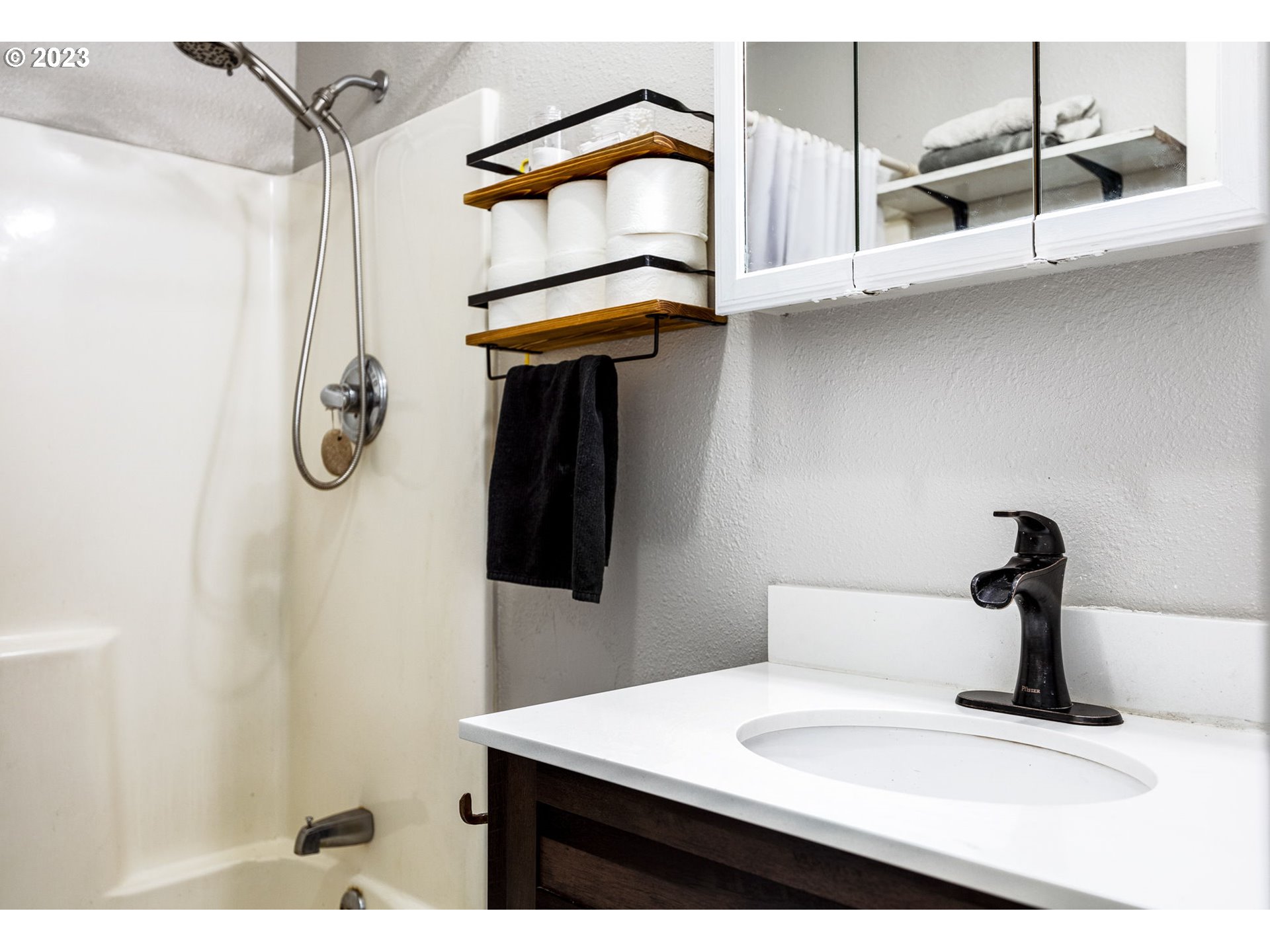2065 G Street Springfield, OR 97477 - Photo 17 of 37 a bathroom with a sink and a mirror