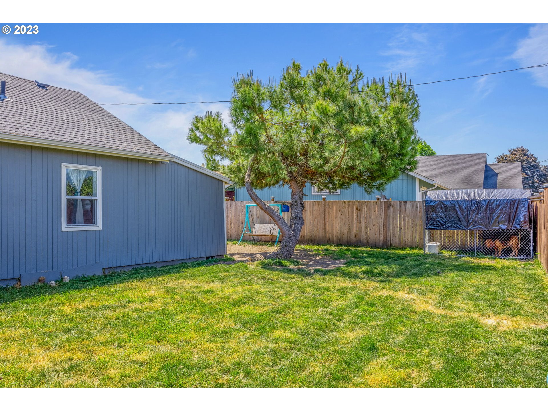 2065 G Street Springfield, OR 97477 - Photo 26 of 37 a backyard of a house with lots of green space
