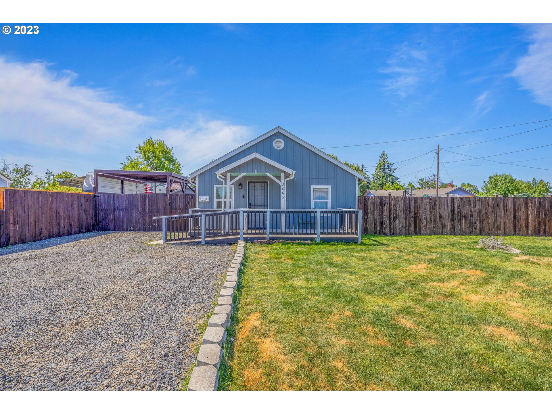 2065 G Street Springfield, OR 97477 - Photo 3 of 37 a bathroom with a sink yard and wooden fence