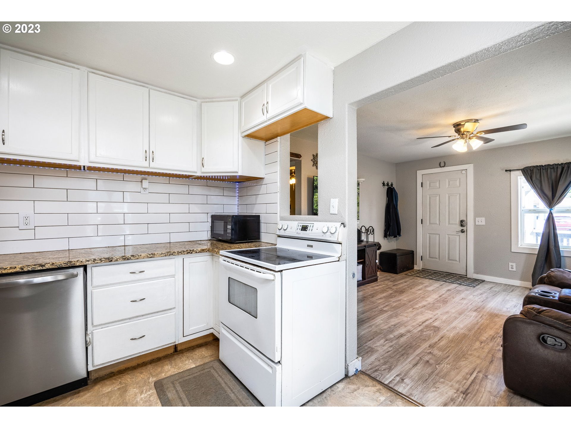 2065 G Street Springfield, OR 97477 - Photo 8 of 37 a kitchen with cabinets a sink and appliances