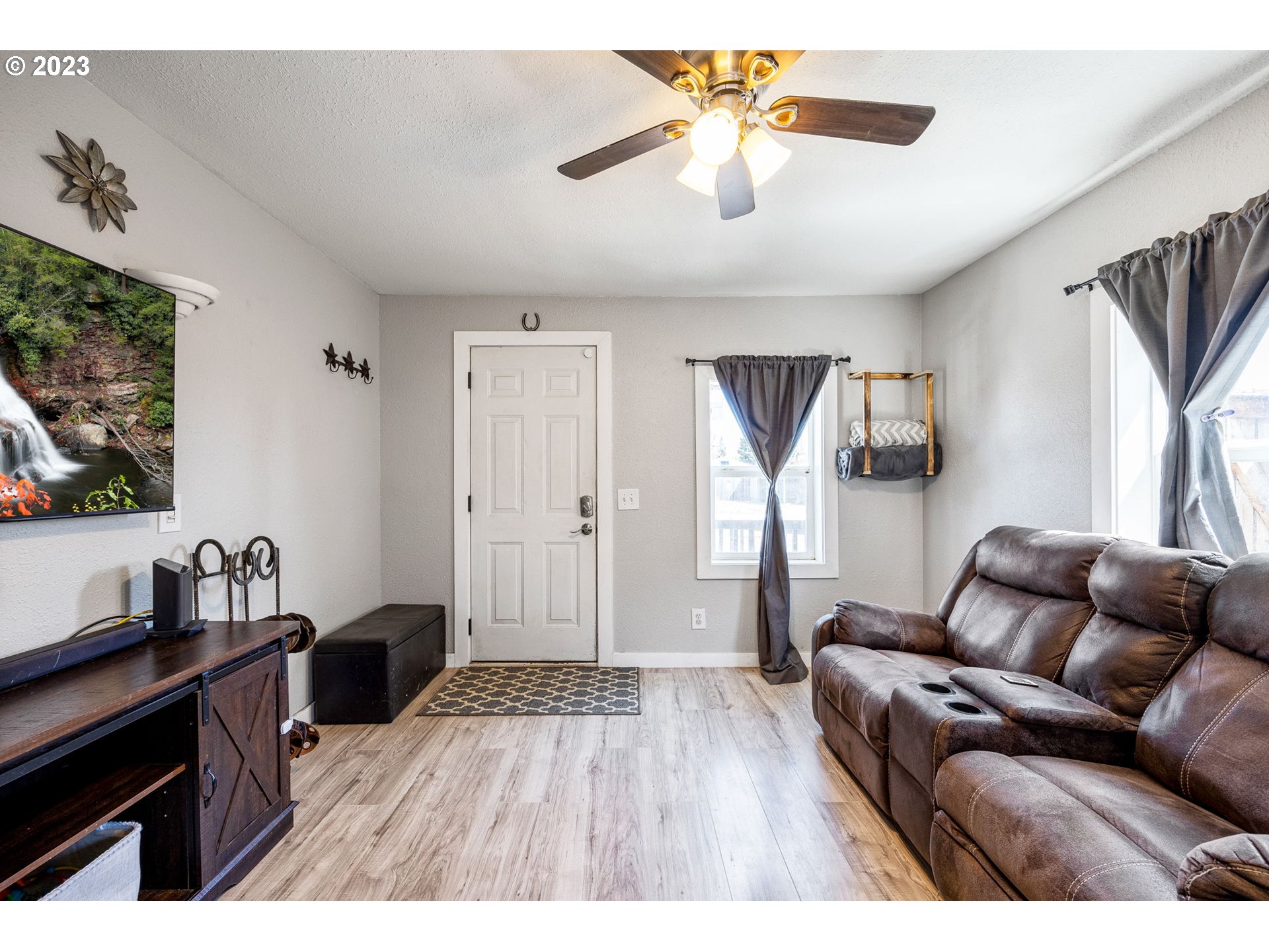 2065 G Street Springfield, OR 97477 - Photo 9 of 37 a living room with furniture and a flat screen tv