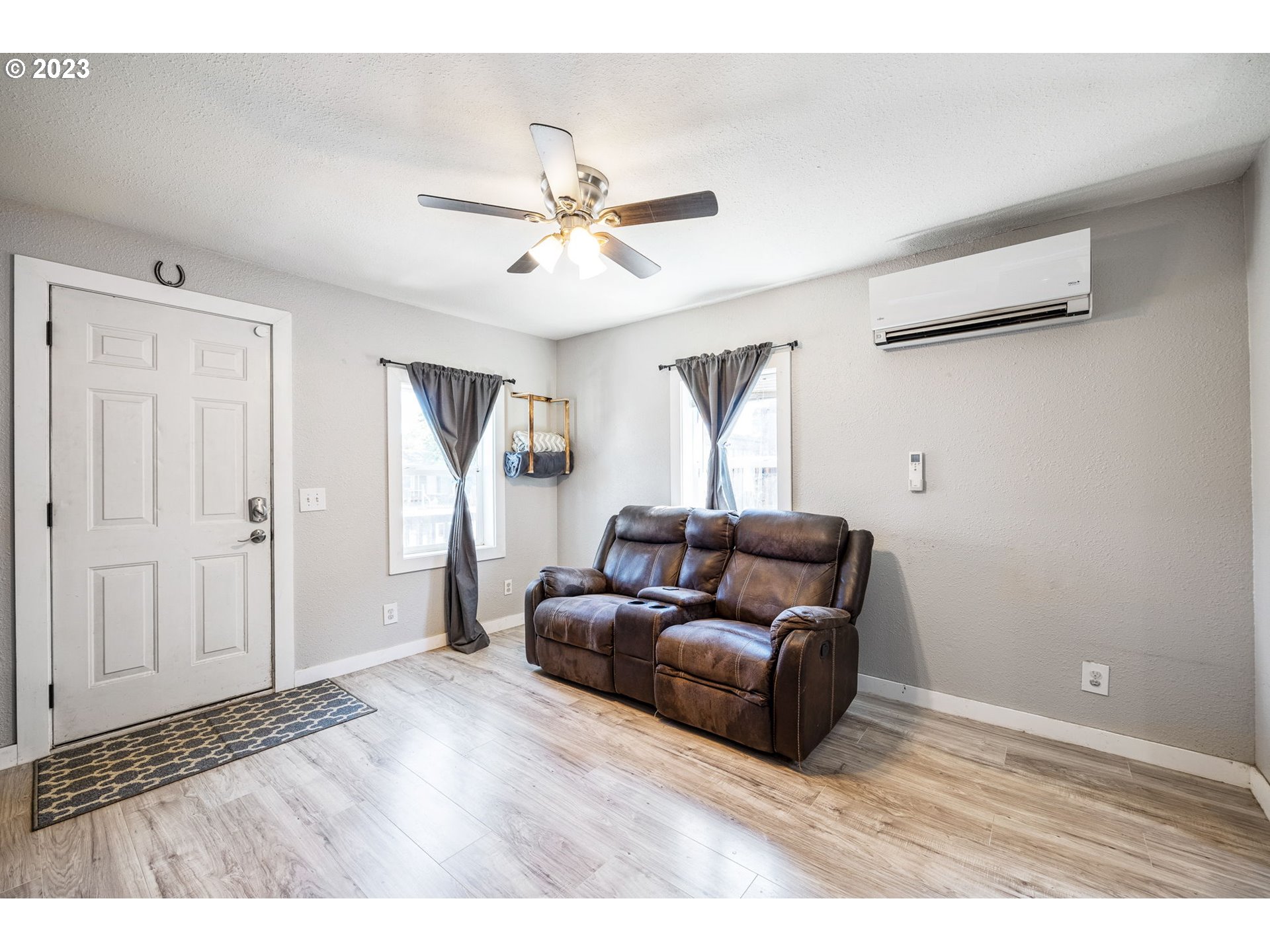 2065 G Street Springfield, OR 97477 - Photo 10 of 37 a living room with furniture and a ceiling fan