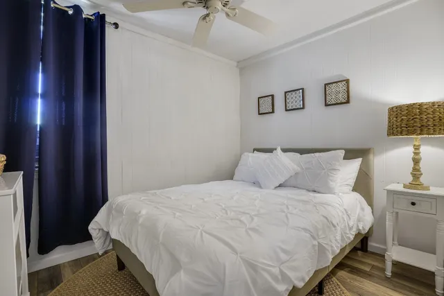 a bedroom with a bed and a lamp