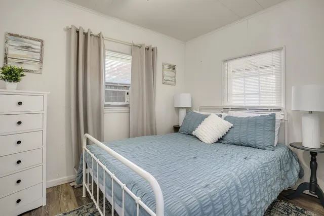 a bedroom with a bed and a dresser