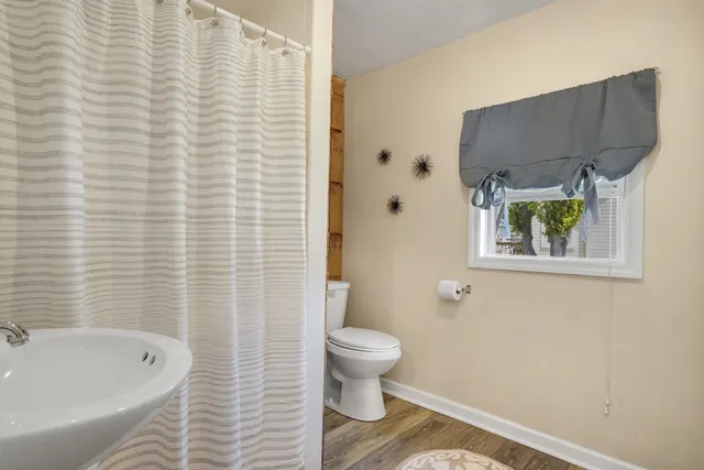 a bathroom with a toilet and a sink