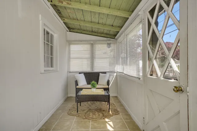 a chair and a table in a balcony