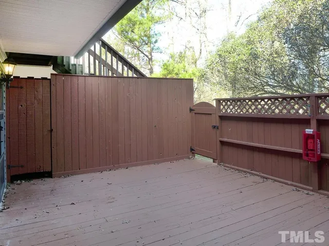 a view of a house with a fence in it