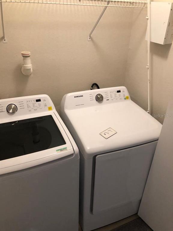 3397 South Kirkman Road, Unit 1435 Orlando, FL 32811 - Photo 11 of 11 a utility room with dryer and washer