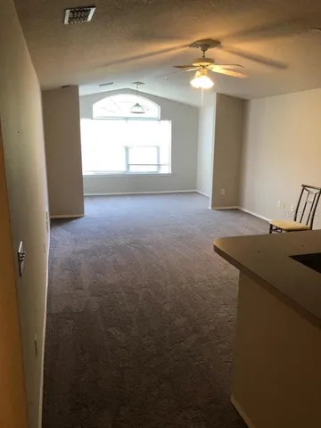 a view of a livingroom with furniture and chandelier