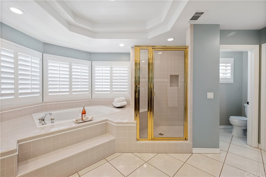 5817 Royale Place Riverside, CA 92506 - Photo 47 of 64 over-sized jacuzzi tub with separate shower. Generous walk-in closet to the left.