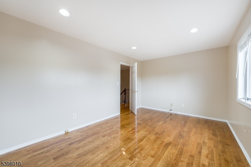 1 Avery Court Madison, NJ 07940 - Photo 28 of 45 an empty room with wooden floor and windows
