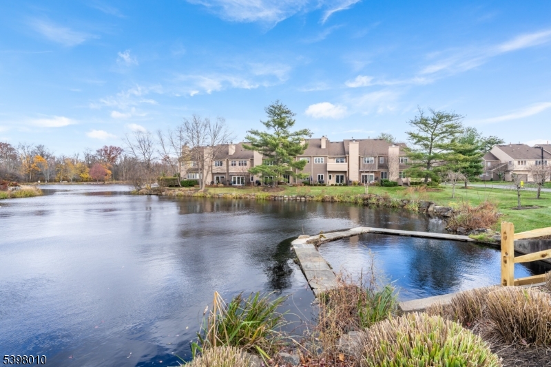 1 Avery Court Madison, NJ 07940 - Photo 3 of 45 a view of a lake with houses in the background