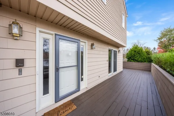 a view of a house with a yard and wooden floor