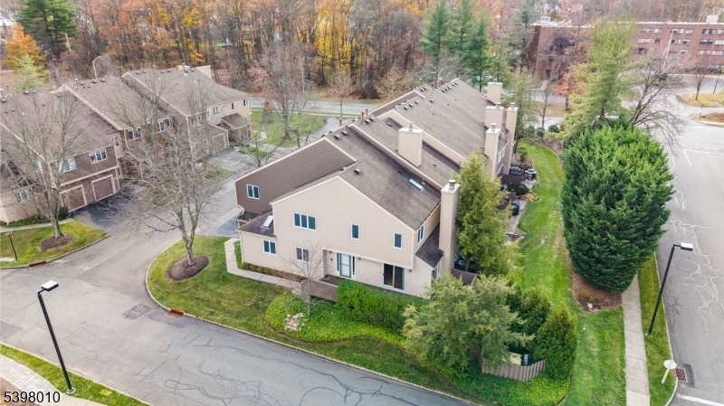 1 Avery Court Madison, NJ 07940 - Photo 42 of 45 a white building with a big yard plants and large trees