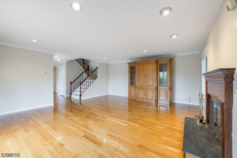 1 Avery Court Madison, NJ 07940 - Photo 9 of 45 a view of an empty room with wooden floor and a window