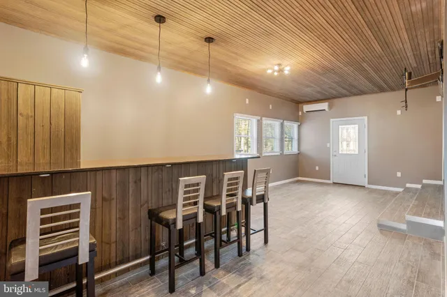 a view of a livingroom with furniture window and wooden floor
