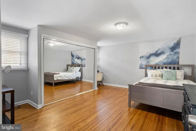 a bedroom with bed and a window