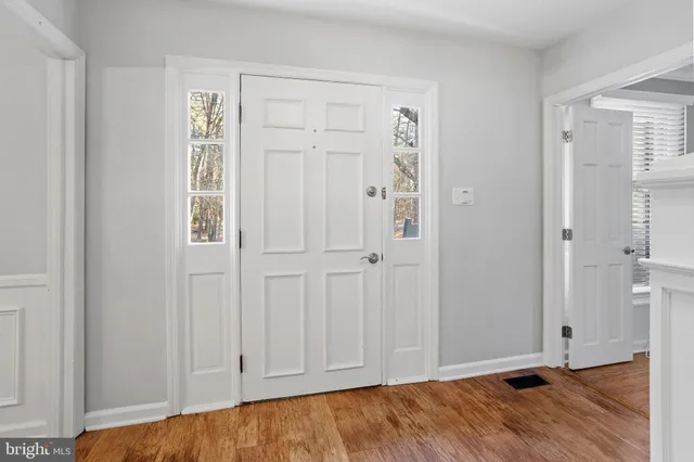 an empty room with wooden floor