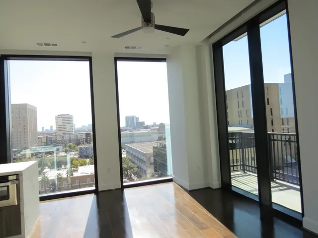 a view of a glass door with a balcony