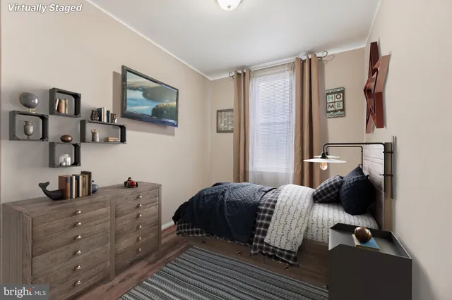 a bedroom with a bed and cabinets