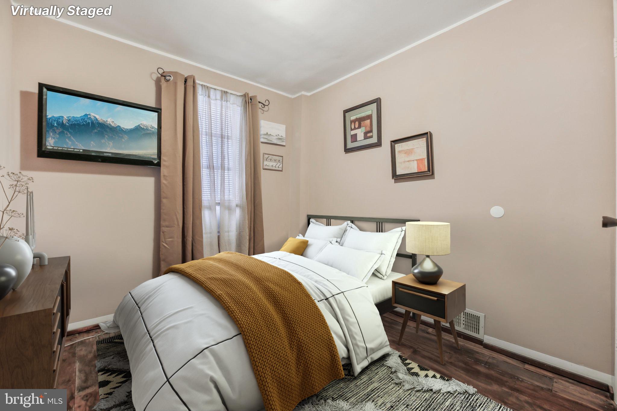 904 North Rosedale Street Baltimore, MD 21216 - Photo 23 of 38 a bedroom with a bed and a wall painting